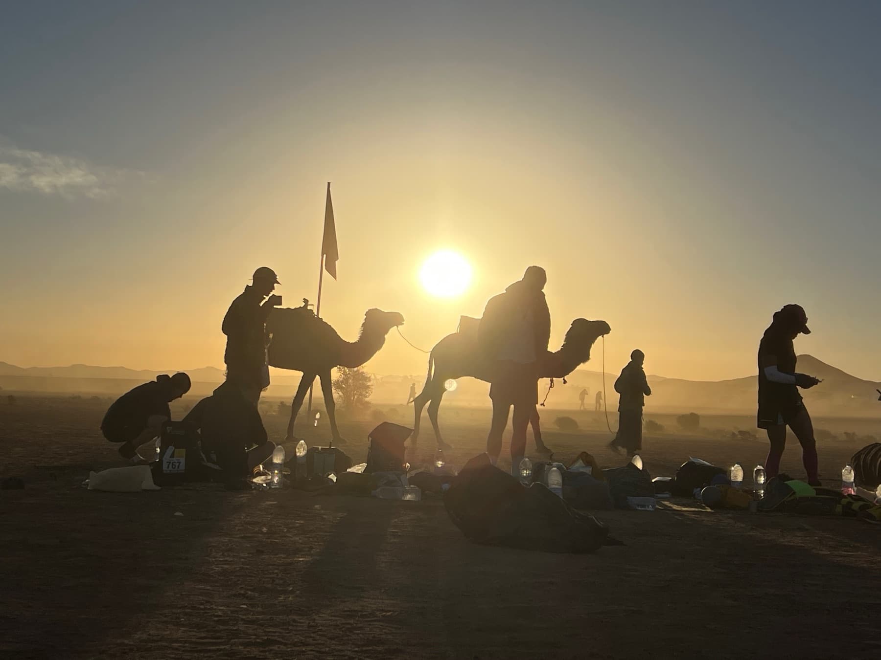 Sunrise on day 1 over the MdS camp with camels and runners packing up