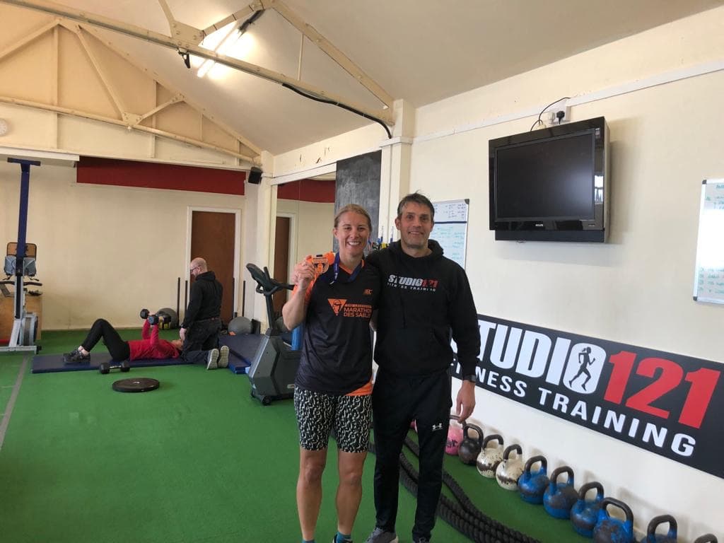 Charlotte in her MdS finisher tee with Rich at Studio 121 gym