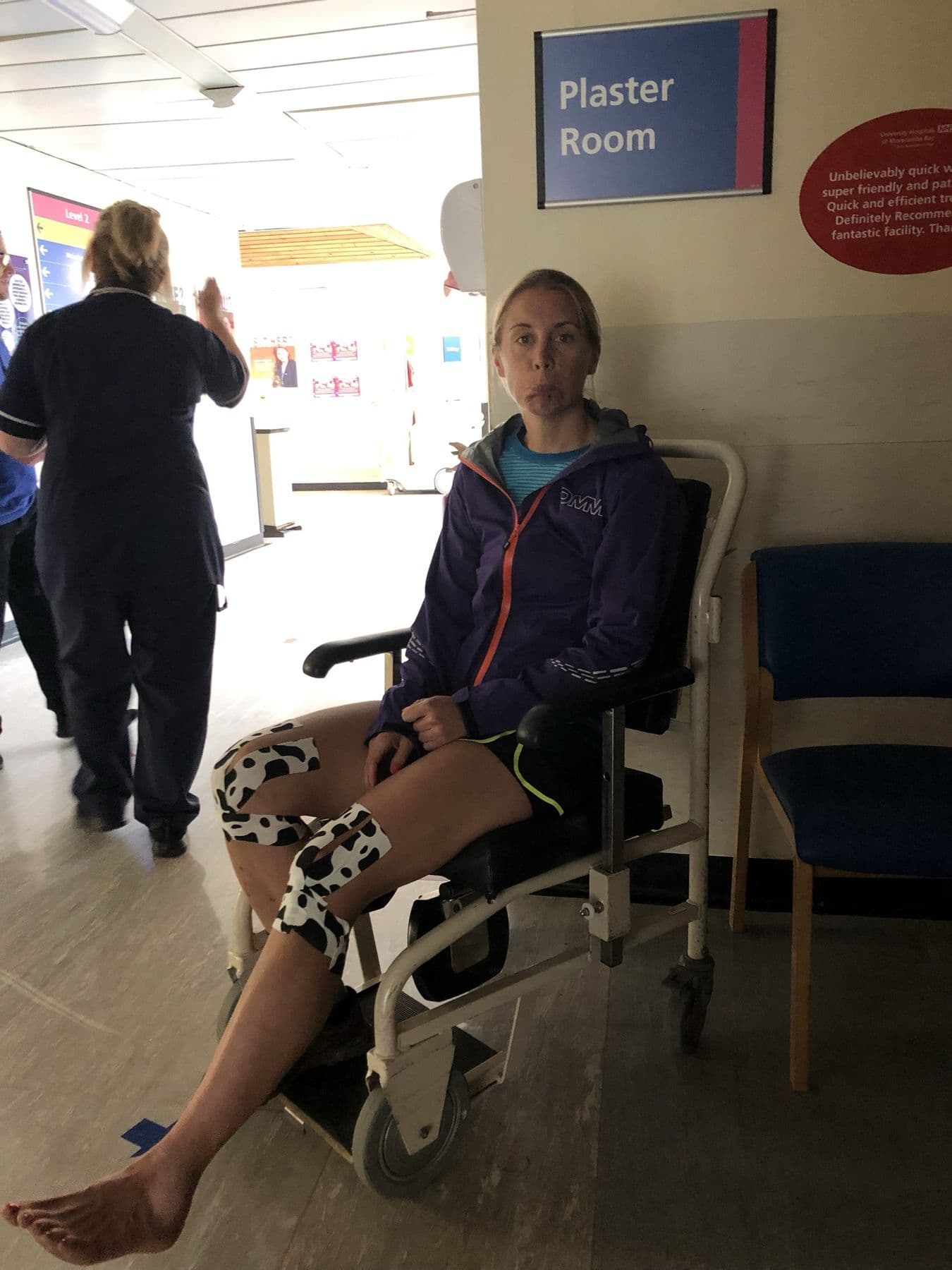Runner waiting in a wheelchair outside the hospital plaster room for an x-ray