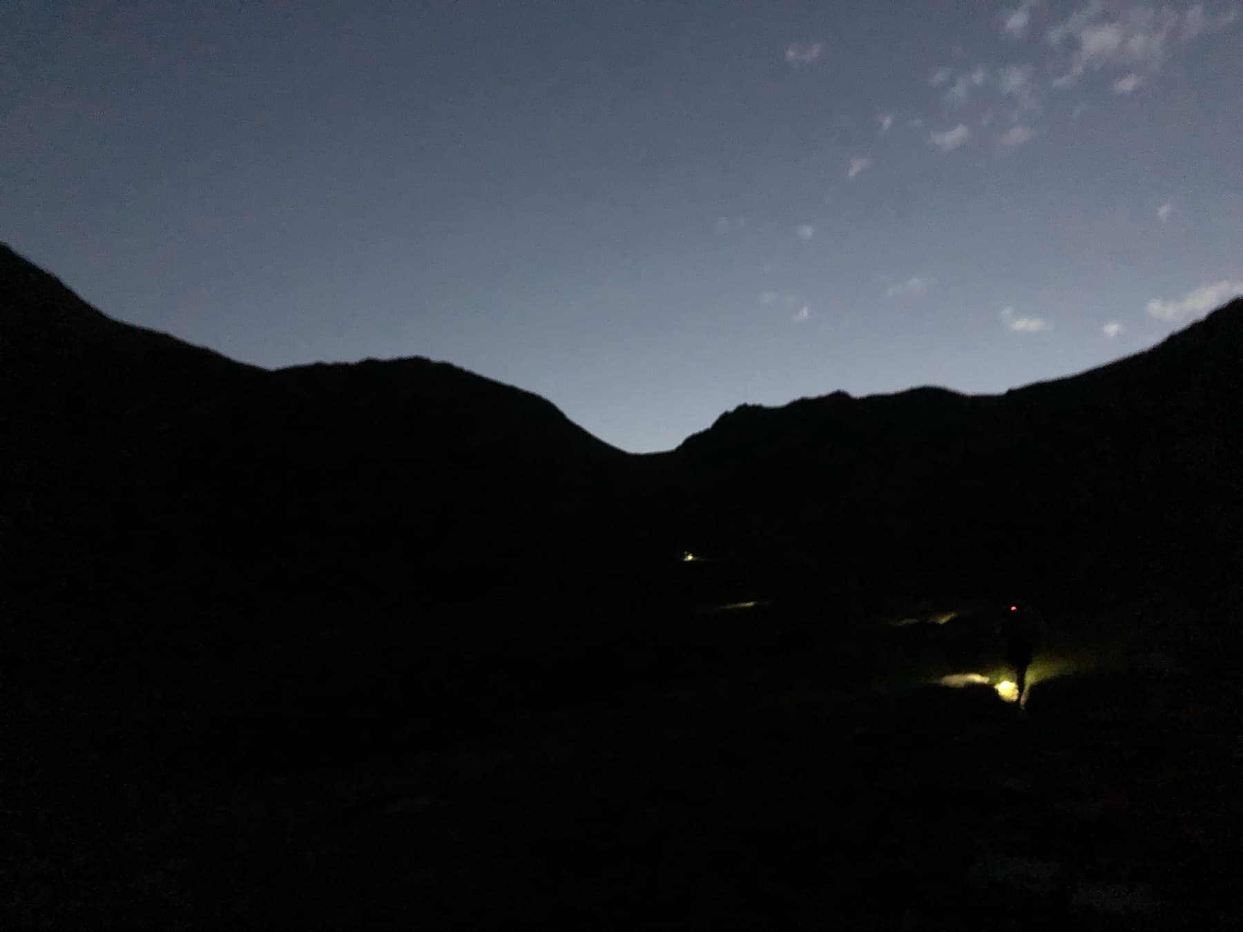 Head torch lights on the dark mountain path during the second big climb