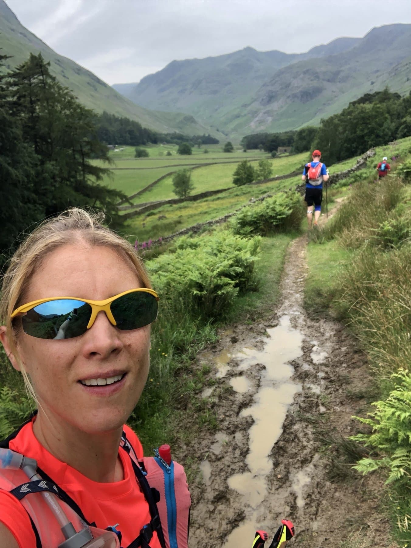 Runner selfie on a muddy trail heading up the Grisedale Valley