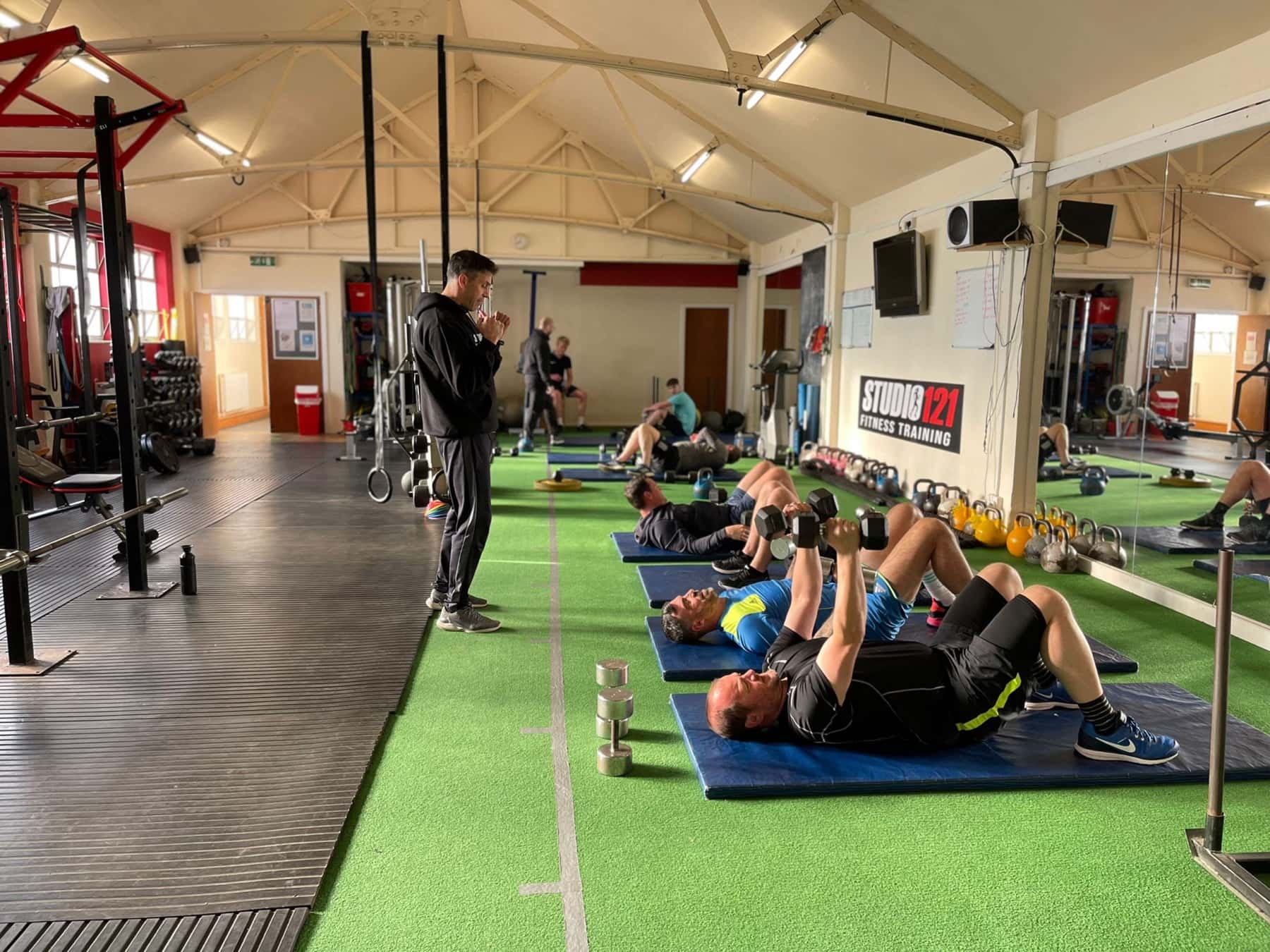 Semi-private training session at Studio 121 with a trainer coaching a small group