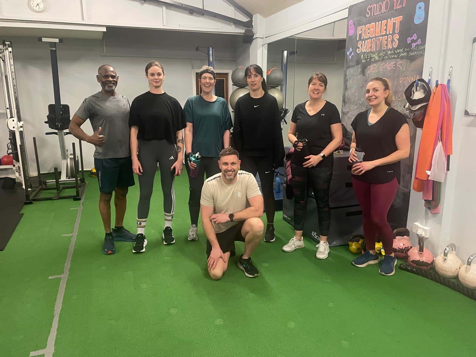 Small group training clients with their coach at Studio 121