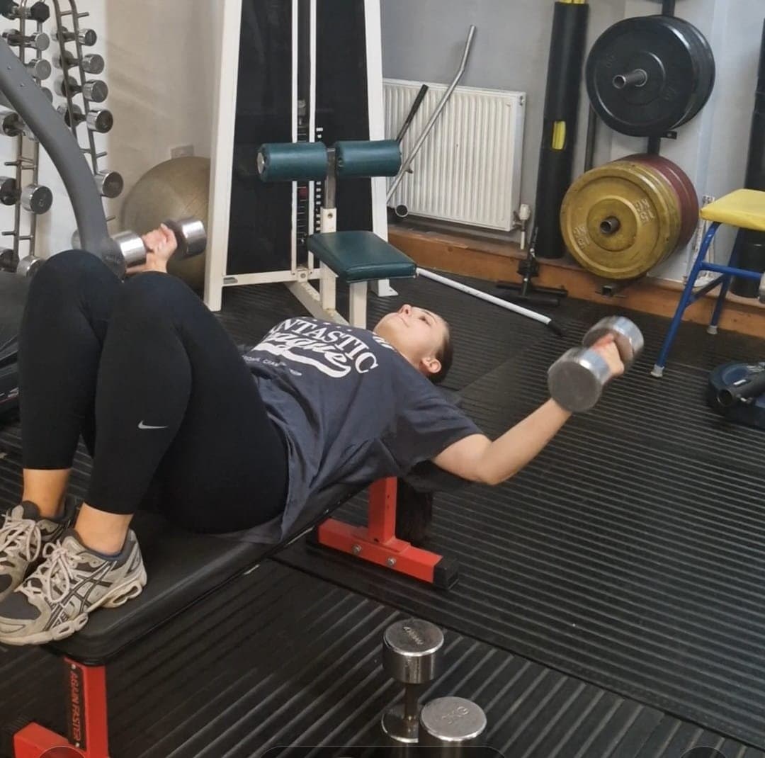 Dumbbell press in a Ladies That Lift session